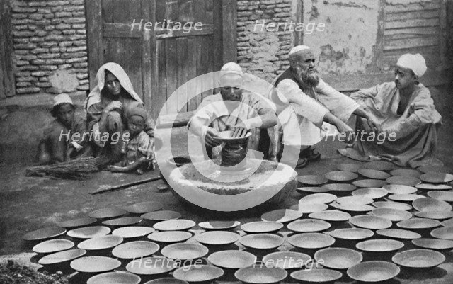 Kashmiri potters at work, 1902. Artist: Bourne & Shepherd.