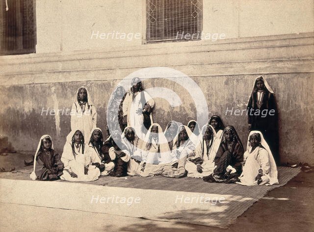 Kashmiri women in traditional dress: group portrait, c1900. Creator: Unknown.