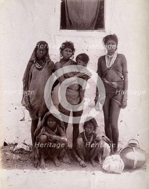 A group of women and children wearing decorated rings in their noses: Bombay at the..., 1896/1897. Creator: Unknown.