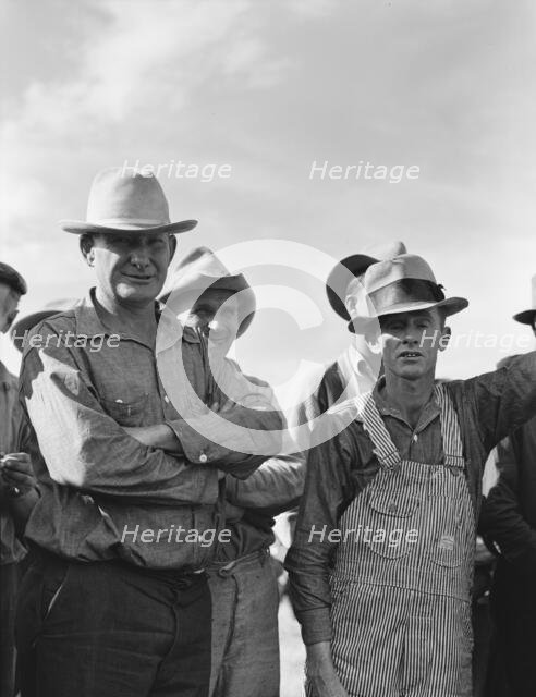 Watching ball game, Shafter camp for migrants, California, 1938. Creator: Dorothea Lange.