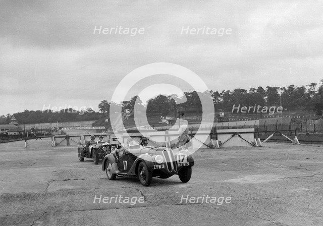 Frazer-Nash BMW 328 and Riley at the chicane, JCC Members Day, Brooklands, 1939. Artist: Bill Brunell.