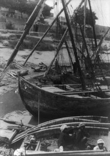 Sailboats and natives at shore, Egypt?, between 1910 and 1925. Creator: Frances Benjamin Johnston.