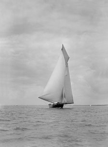 The cutter racing yacht 'Terpsichore' running downwind, 1922. Creator: Kirk & Sons of Cowes.