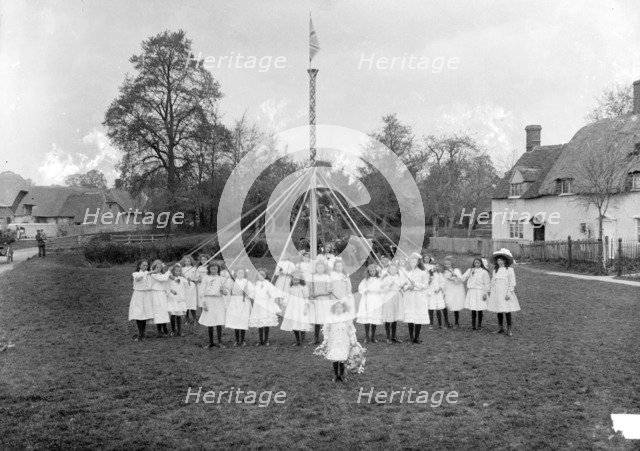 Children dance around the village maypole, East Hanney, Oxfordshire, c1860-c1922. Artist: Henry Taunt