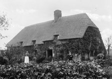 Thatched cottage with women standing outside, Shellingford, Oxfordshire, c1860-c1922. Artist: Henry Taunt