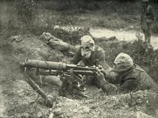 'Machine Gunners in Action Wearing their Gas Helmets', (1919).  Creator: Unknown.