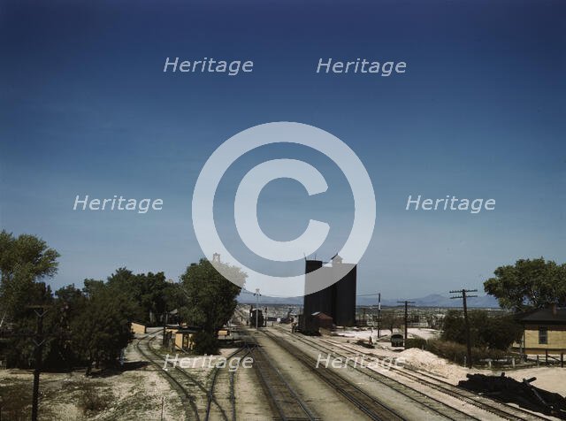 Santa Fe R.R. going through Yucca, Arizona; a watering and refueling stop, 1943. Creator: Jack Delano.