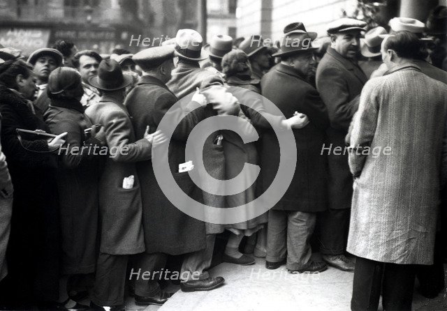Group of people standing in line to visit the funeral chapel of Francesc Macia, president of the …