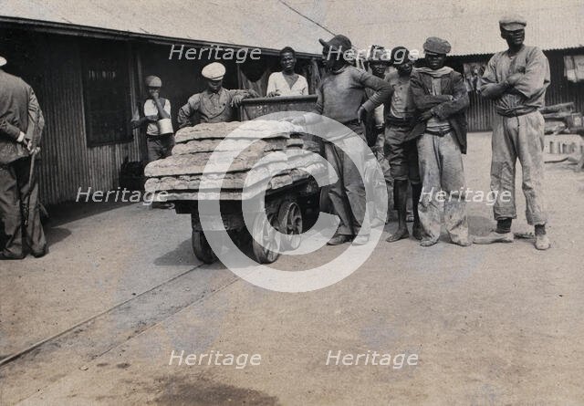 South Africa: bread carried on trolleys for the African workers at De Beers Mine, 1905. Creator: Hugh Marshall.
