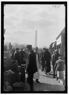 Market; Washington Monument in background, between 1916 and 1918. Creator: Harris & Ewing.