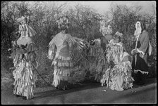 A group of people in costume performing in a Mummers' play, Andover, Test Valley, Hampshire, 1948. Creator: George R Long.