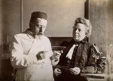 Professor and Mrs Dejerine looking at a microscopic sample of the human brain, c1900s. Creator: Unknown.