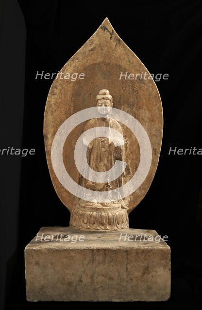 Buddhist tablet: standing figure in high relief; right hand missing, Period of Division, 551 CE. Creator: Unknown.