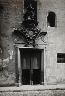Hospital de la Santa Cruz, Barcelona: the doorway.. with a statue of Charity..., c1900s. Creator: Unknown.