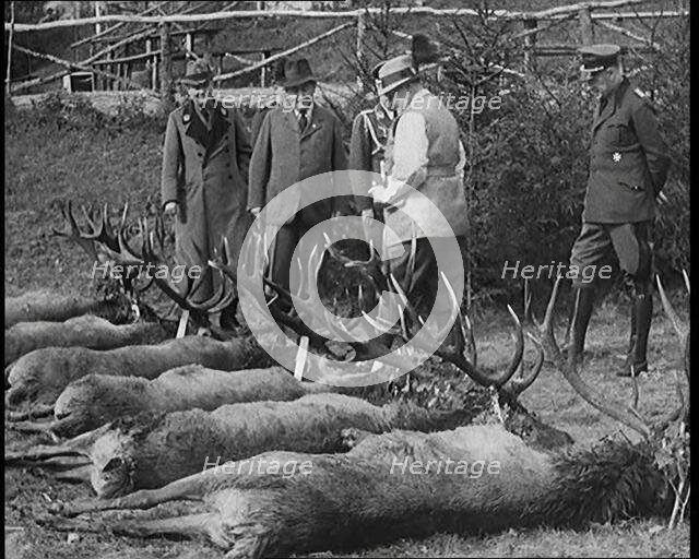 Nazi Officer Hermann Goering in Hunting Dress Showing His Colleagues a Line of Deer He Has..., 1931. Creator: British Pathe Ltd.