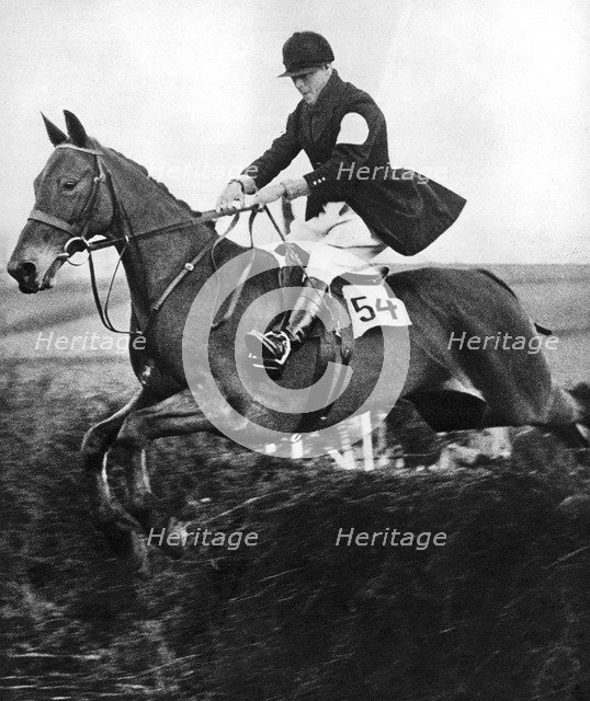 The Prince of Wales taking a fence in the bridge of Guards Challenge Cup race, c1930s. Artist: Unknown