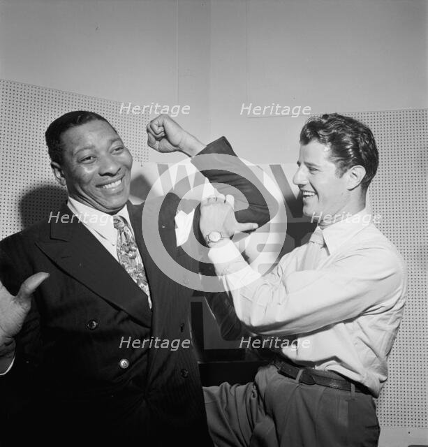 Portrait of Sid Catlett and Freddie Robbins, WOV office, New York, N.Y., ca. June 1947. Creator: William Paul Gottlieb.