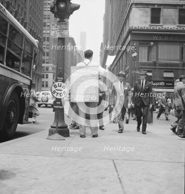 Street hawker selling Consumer's..., 42nd Street and Madison Avenue, New York City, 1939. Creator: Dorothea Lange.