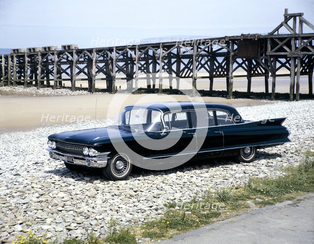 A 1961 Cadillac Presidential limousine on a beach. Artist: Unknown