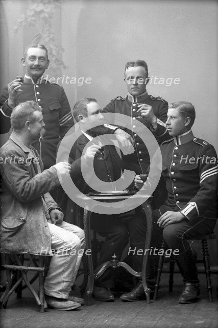 Five men drinking in the photographer's studio, Landskrona, Sweden, 1910. Artist: Unknown