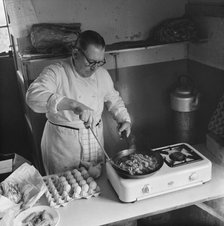 Preparing food for staff working on the construction site of the M1, 09/1958. Creator: John Laing plc.