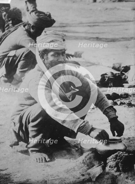 Indian soldier cooking, in France, between c1914 and c1915. Creator: Bain News Service.