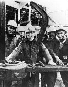 Margaret Thatcher with technicians aboard the North Sea oil rig 'Sea Quest', 10th September 1975. Artist: Unknown