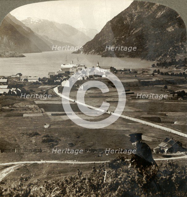 'Village roofs and sunny fields of Odde, N. up the narrow mountain-walled Sorfjord, Norway', 1905. Creator: Unknown.