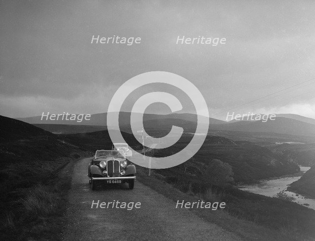 Rover open tourer of HE Gibbon competing in the RSAC Scottish Rally, 1936. Artist: Bill Brunell.