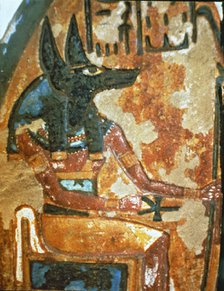 Fragment of a familiar stela in a chapel of worship, showing God Anubis.