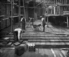 Construction workers laying a hollow pot floor, 8 Lloyds Avenue, City of London, 1907. Artist: Bedford Lemere and Company.