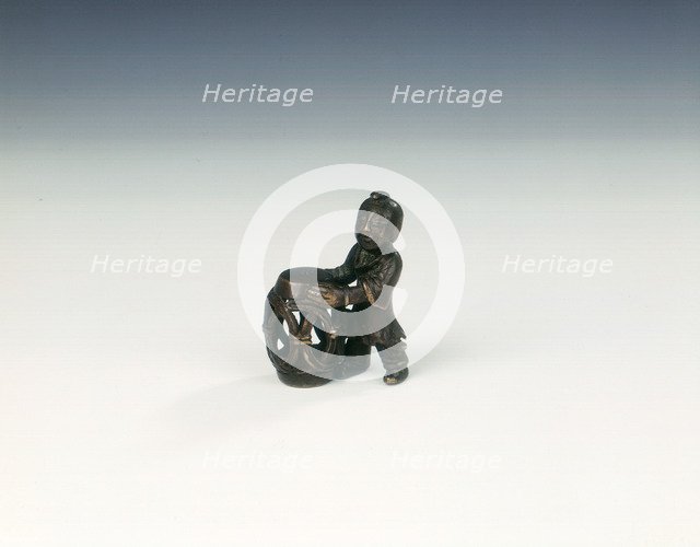 Bronze group of boy with openwork barrel garden seat, Late Ming dynasty, China, 1550-1644. Artist: Unknown