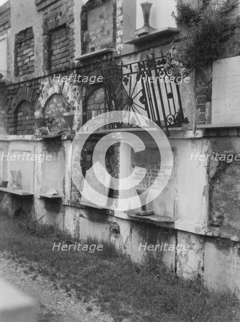 Wall tombs of the old St. Louis Cemetery, New Orleans, between 1920 and 1926. Creator: Arnold Genthe.