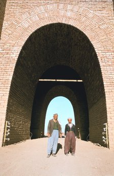 Two workmen outside the Mashki Gate, Nineveh, Iraq, 1977.