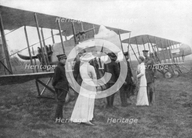 Queen Elisabeth of Belgium visiting Allied pilots, c1915. Artist: Unknown