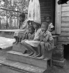 Turpentine worker's family near Cordele, Alabama, 1936. Creator: Dorothea Lange.
