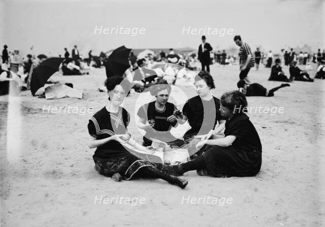 Picnicing on the beach, between 1900 and 1905. Creator: Unknown.