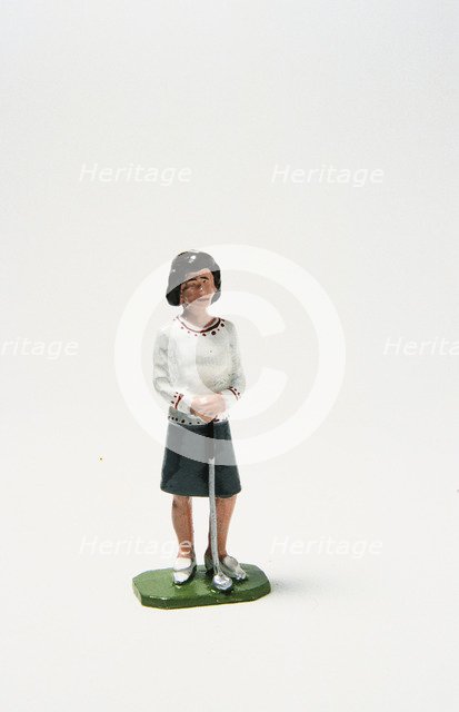 Lead figure of woman golfer, c1920s. Artist: Unknown