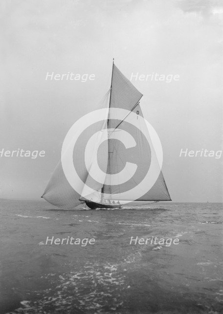 The majestic 15 Metre class 'Pamela' sailing with spinnaker, 1913. Creator: Kirk & Sons of Cowes.