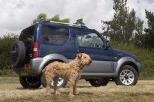 2009 Suzuki Jimny SZ4 with pet dog Artist: Unknown.