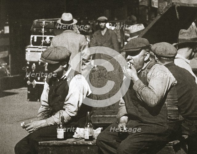 Day labourers having a hot dog and lemonade, Battery Park, New York, USA, early 1930s. Artist: Unknown