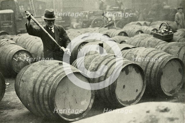"There Are a Quarter of a Million Gallons of Port in the Port Vaults" - Wine Gauging Ground', 1937. Creator: Fox.