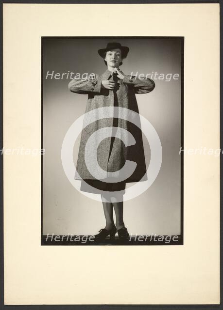 Woman modeling a coat, early 1940s. Creator: Gunther Krampf.