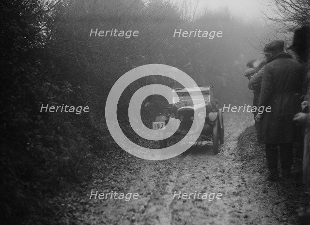 Austin 7 of HC Jacobs competing in the MCC Exeter Trial, Meerhay, Dorset, 1930. Artist: Bill Brunell.