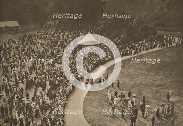 'A Glimpse of One of the Annual Royal Garden Parties Among The Timbered Lawns of Buckingham Palace', Creator: Unknown.