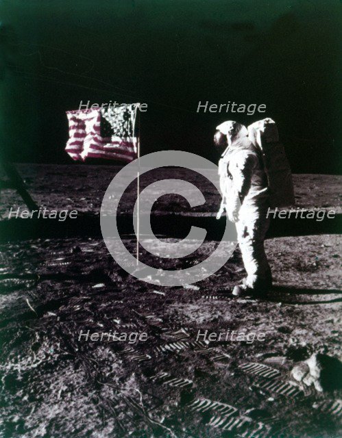 Buzz Aldrin stands next to the American flag on the surface of the Moon, July 1969. Creator: Neil Armstrong.