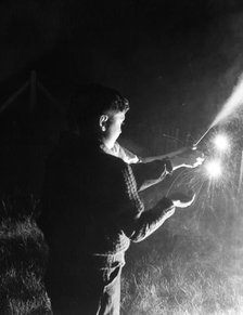 Children with fireworks, c1955. Creator: Arthur Charles Kirby Ware.