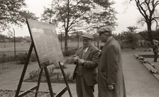 Two men in flat caps look at the bowls scoreboard, York, Yorkshire, 1955. Artist: Unknown