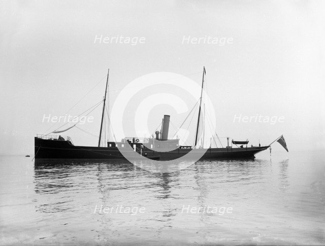 The 116 ton steam yacht 'Athena' at anchor, 1911. Creator: Kirk & Sons of Cowes.