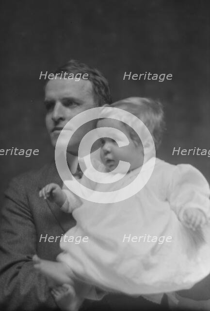 Mitchell, W.C., Mr., and baby, portrait photograph, 1914 May 22. Creator: Arnold Genthe.